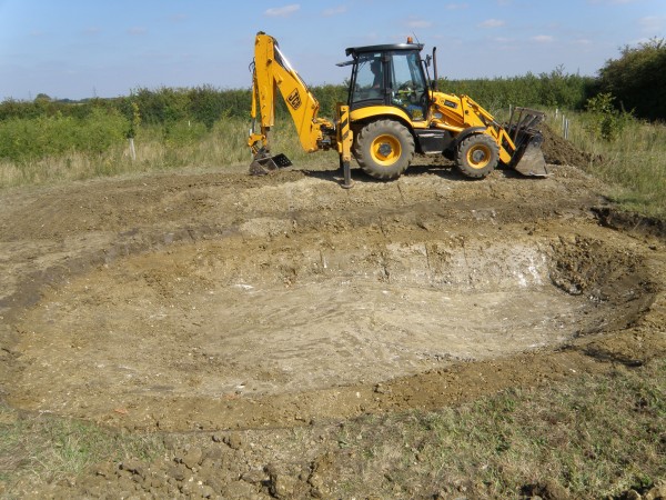 Shaping the spoil heaps - Great Gidding Jubilee Wood pond excavation. Photo: Michael Trolove