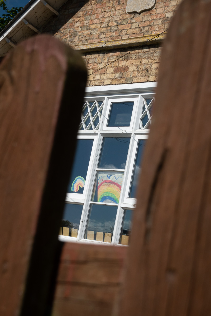 Rainbow 'Stay Safe' posters in window during Covid-19 lockdown at Great Gidding School