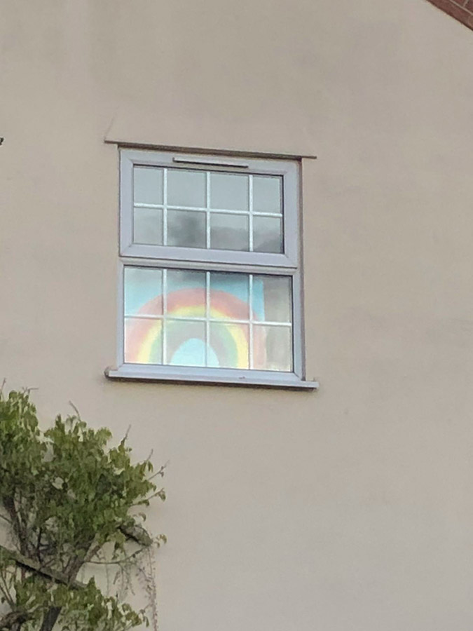Rainbow sign in the window during Covid-19 lockdown