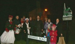 A troop of singers all decorated in tinsel and fairy lights went around the village singing christmas carols